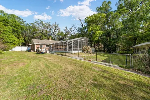 a view of a house with swimming pool and porch