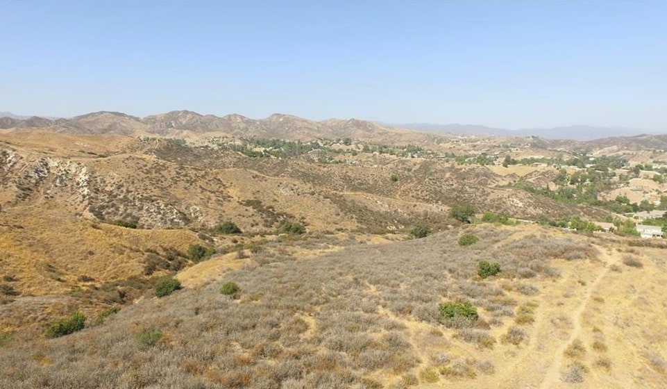 0 Valley Glen Street Castaic, CA 91384 - Photo 5 of 9 a view of a large mountain with mountains in the background
