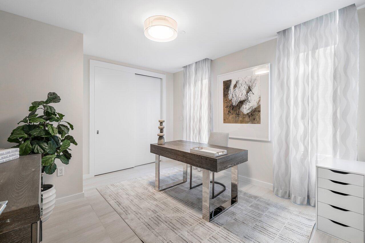 200 Southeast Mizner Boulevard, Unit 211 Boca Raton, FL 33432 - Photo 26 of 67 a view of a workspace with furniture and a potted plant