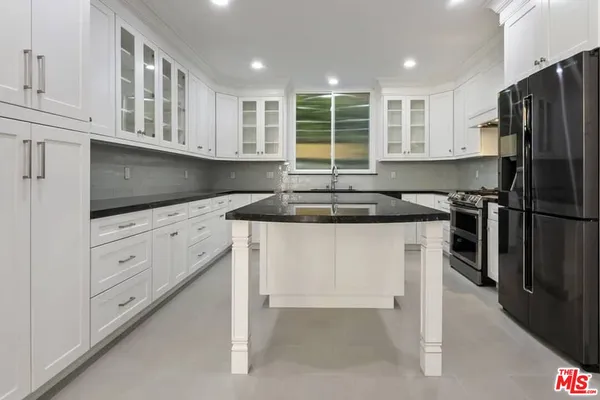 a kitchen that has a cabinets and a stove