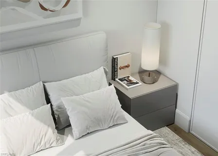 a bedroom with a bed and a cabinets