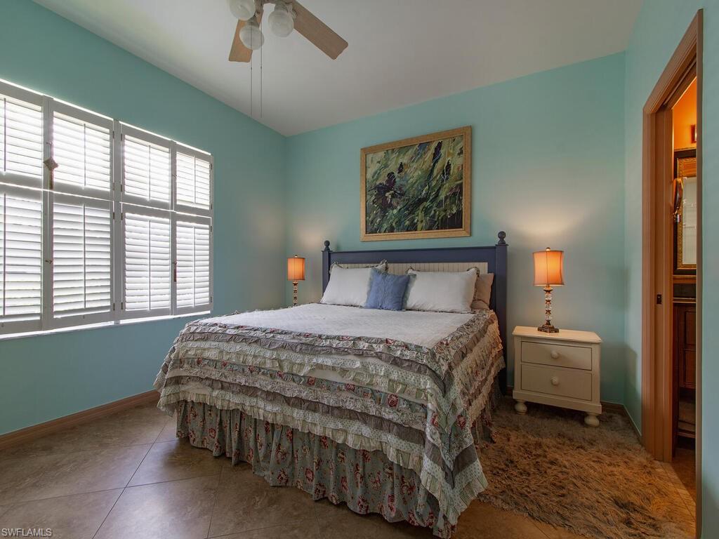 519 Roma Court, Unit 3101 Naples, FL 34110 - Photo 5 of 12 a bedroom with a bed and window