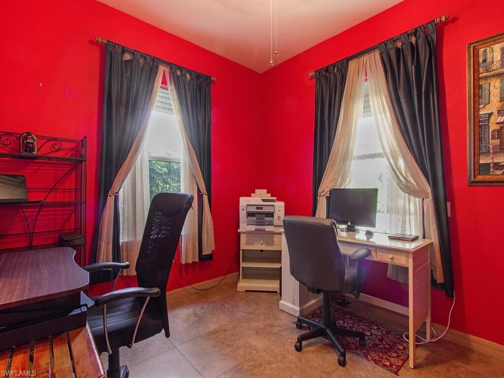 519 Roma Court, Unit 3101 Naples, FL 34110 - Photo 10 of 12 a view of a workspace with furniture and a window