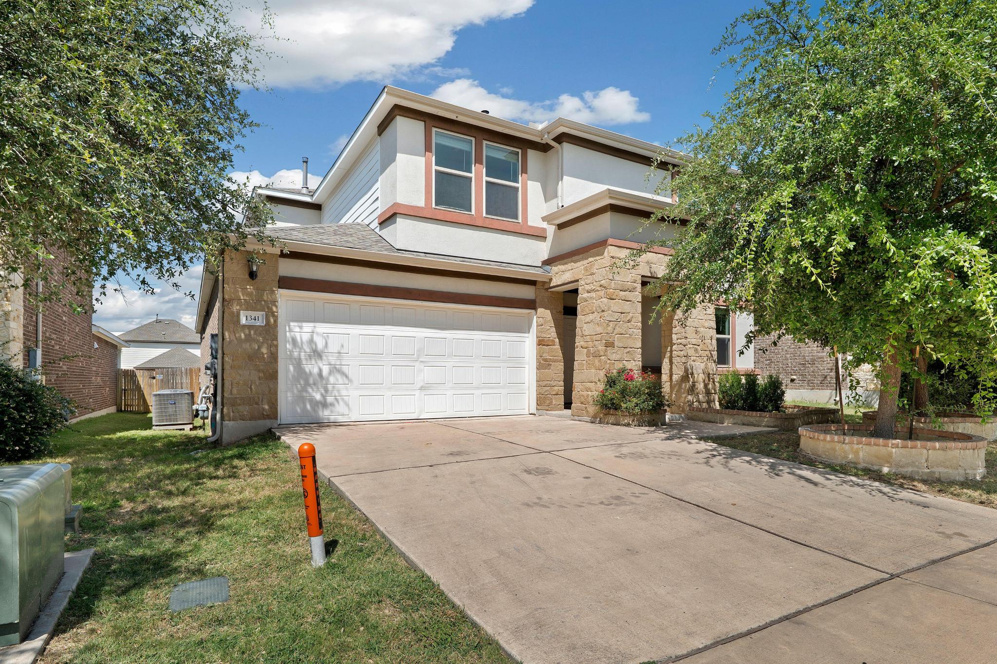 1341 Eagle Ray Street Leander, TX 78641 - Photo 1 of 37 A neatly manicured lawn complements the stone and stucco facade of this inviting residence.