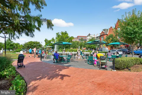 a group of people sitting in a park