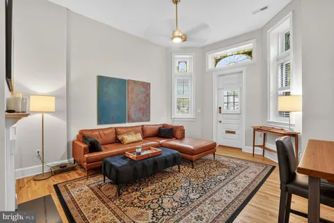 a living room with furniture and a rug