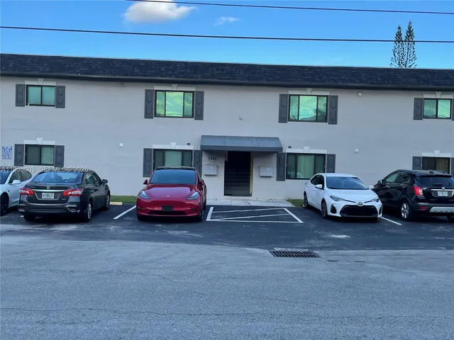 a car parked in front of a house