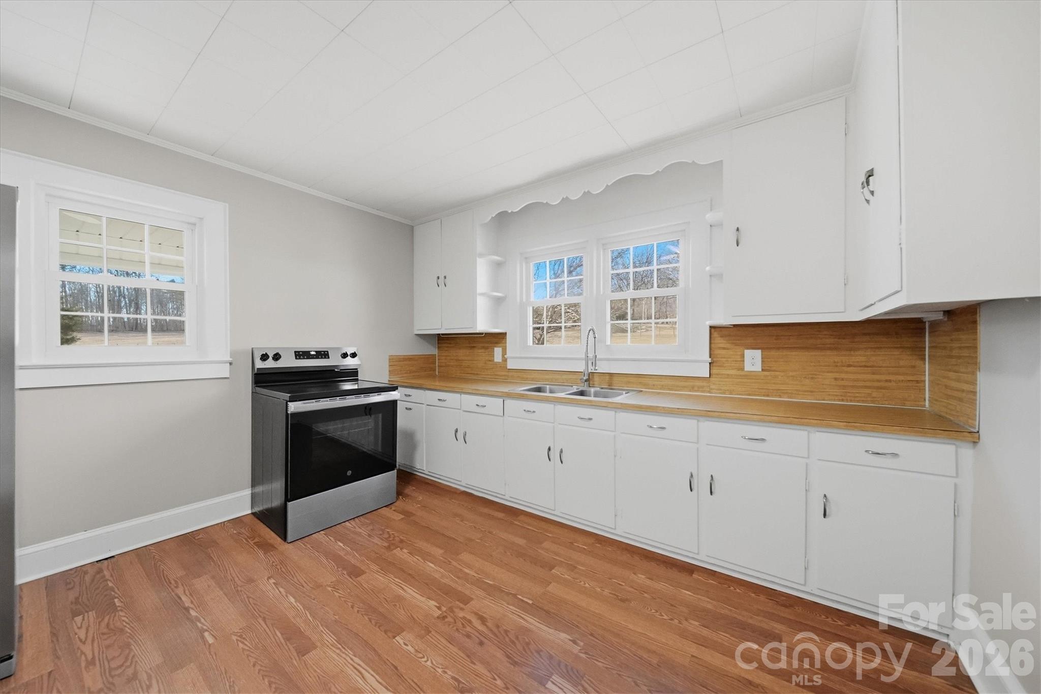 4141 Laney Road Maiden, NC 28650 - Photo 14 of 47 a kitchen with granite countertop a stove and a sink