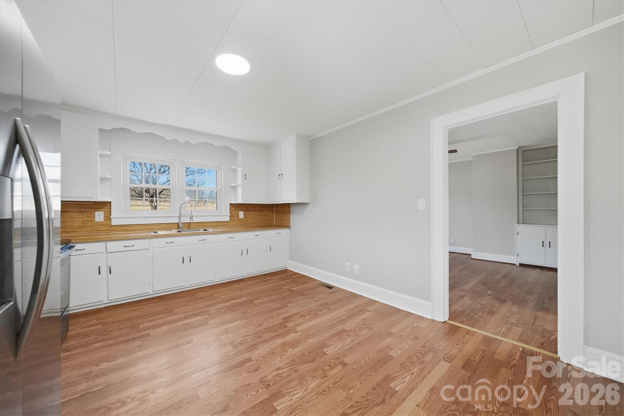 4141 Laney Road Maiden, NC 28650 - Photo 16 of 47 a kitchen with granite countertop a refrigerator and a stove top oven