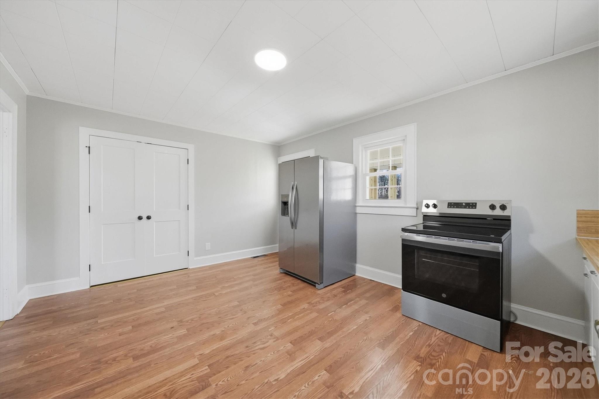 4141 Laney Road Maiden, NC 28650 - Photo 17 of 47 a view of a kitchen with a stove cabinets and wooden floor