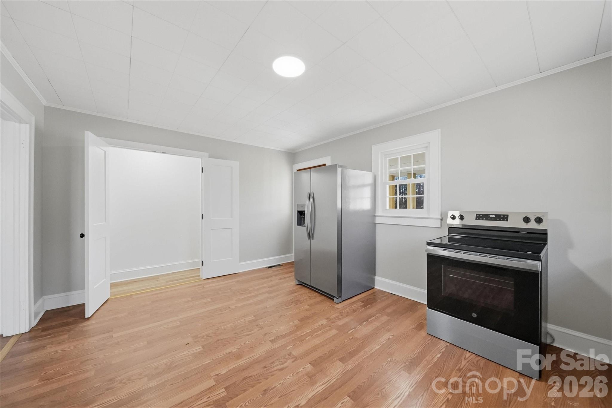 4141 Laney Road Maiden, NC 28650 - Photo 18 of 47 a view of a kitchen with a stove cabinets and wooden floor