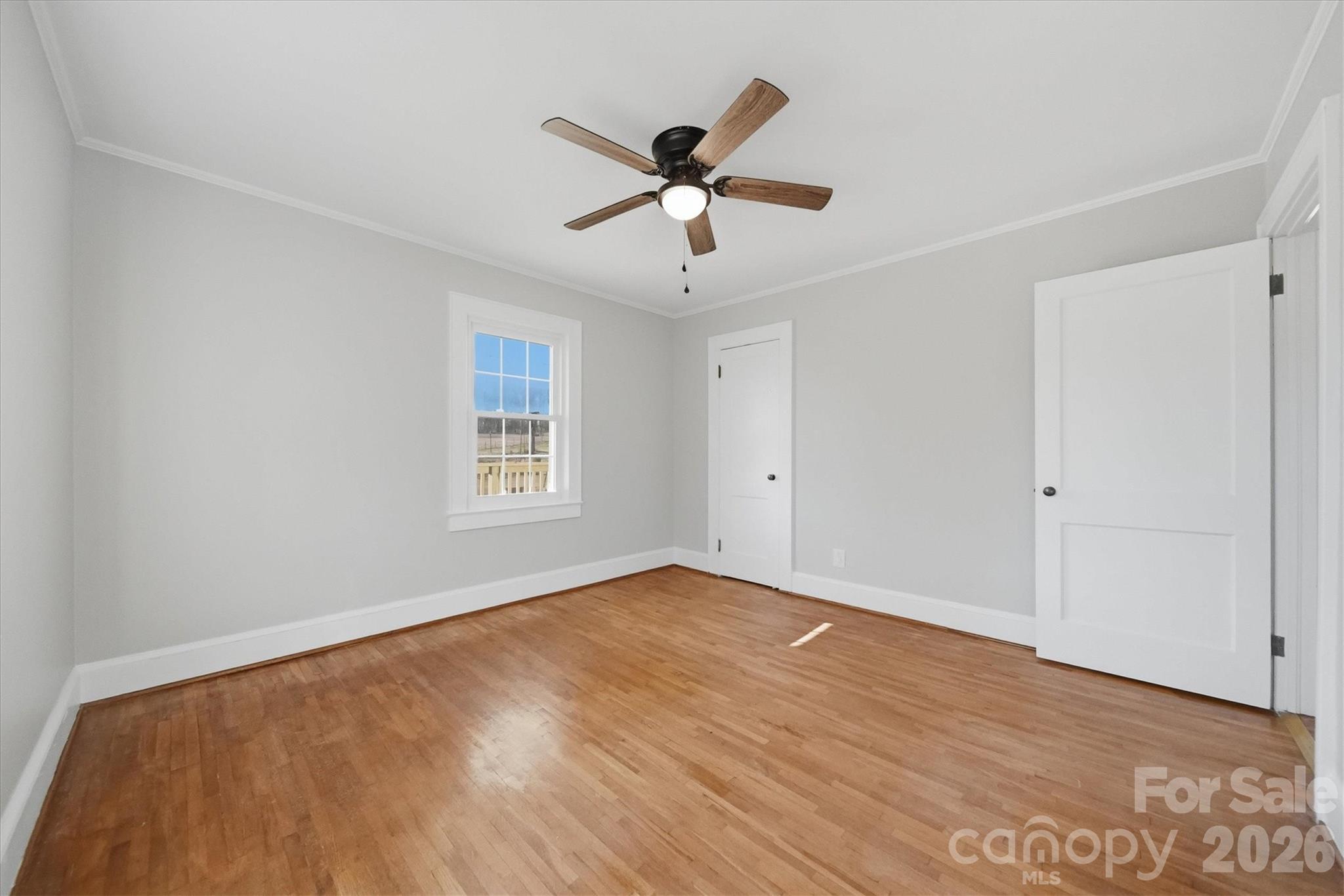 4141 Laney Road Maiden, NC 28650 - Photo 24 of 47 a view of an empty room with window and wooden floor