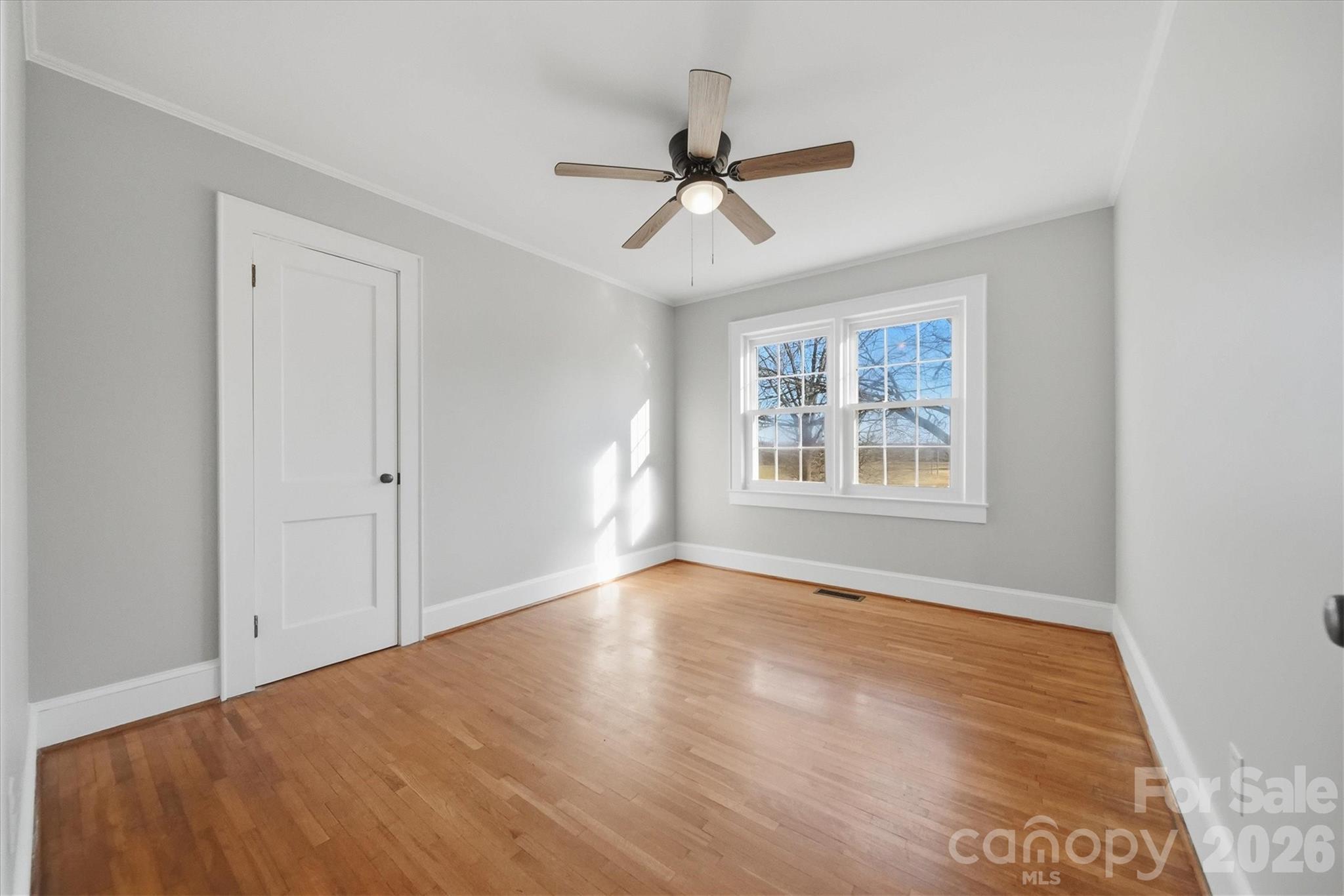 4141 Laney Road Maiden, NC 28650 - Photo 25 of 47 a view of an empty room with a window and wooden floor