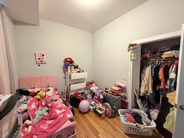 a bedroom with bed and a couch