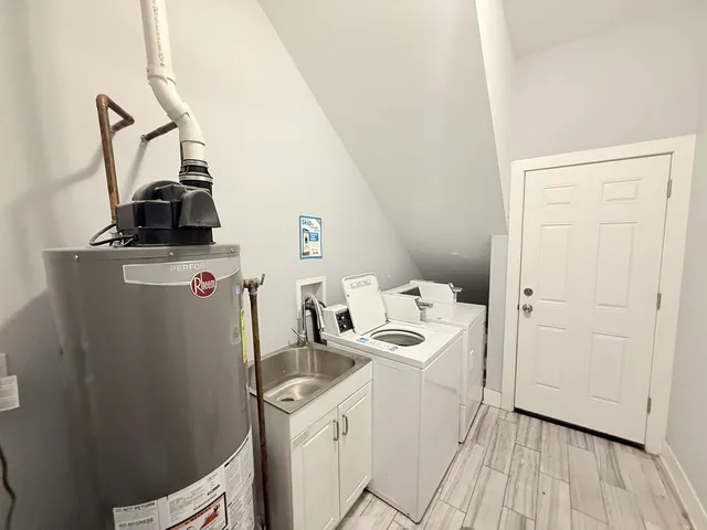 a view of a storage & utility room with a sink