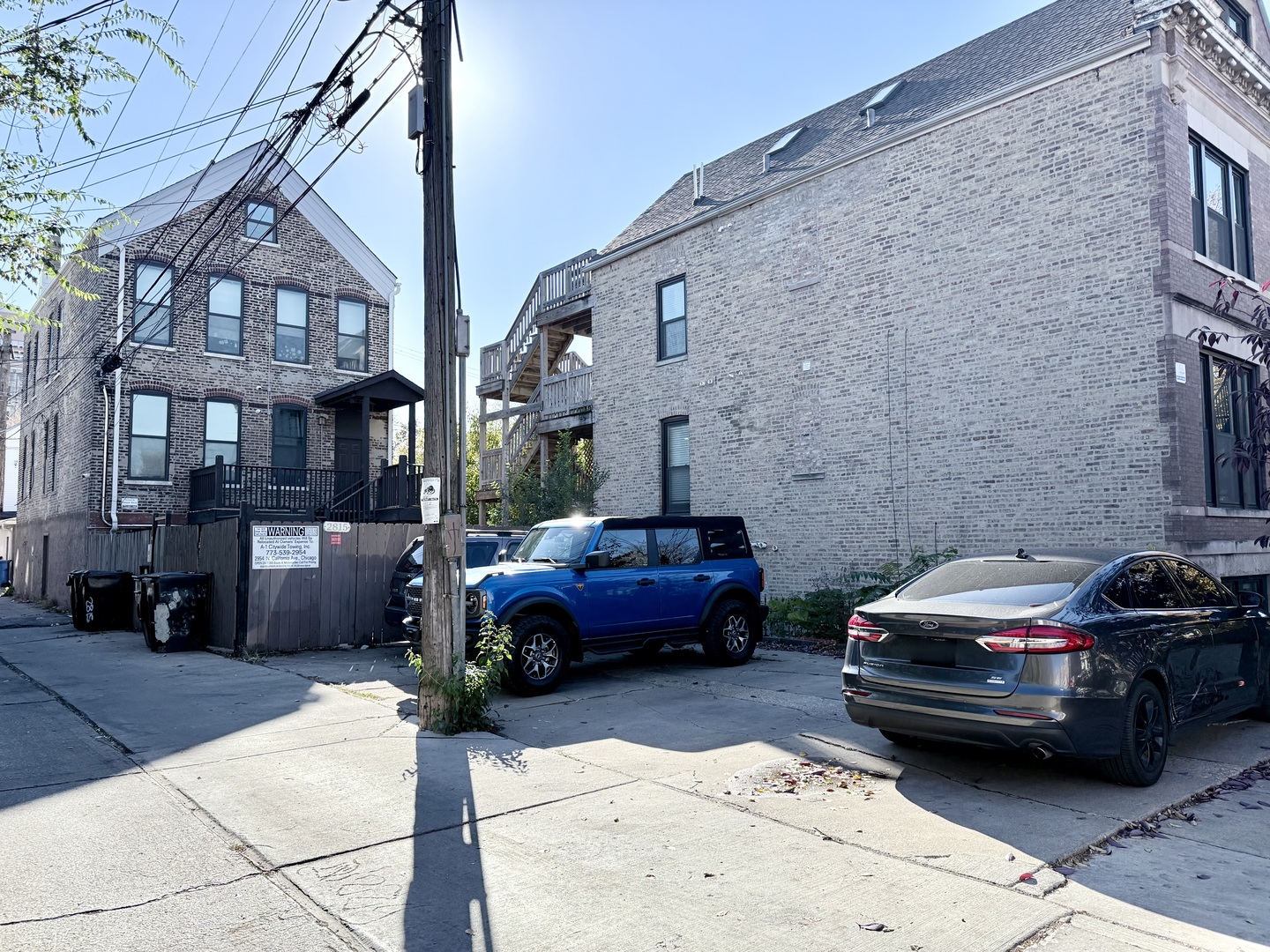 2815 West 25th Street Chicago, IL 60623 - Photo 27 of 27 a car parked in front of a brick building