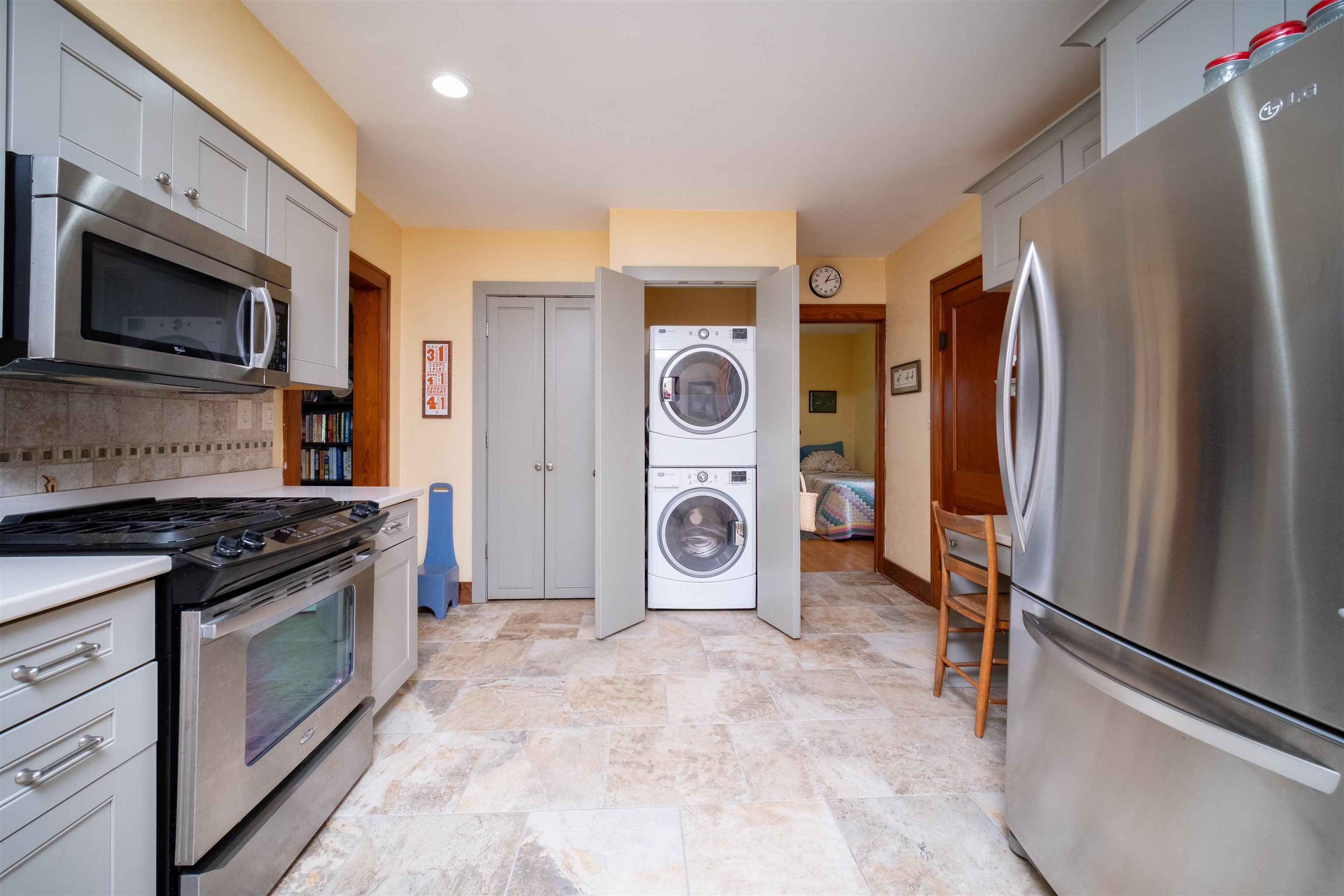 9783 North Main Road Rockton, IL 61072 - Photo 11 of 31 a kitchen with stainless steel appliances granite countertop a refrigerator stove and sink