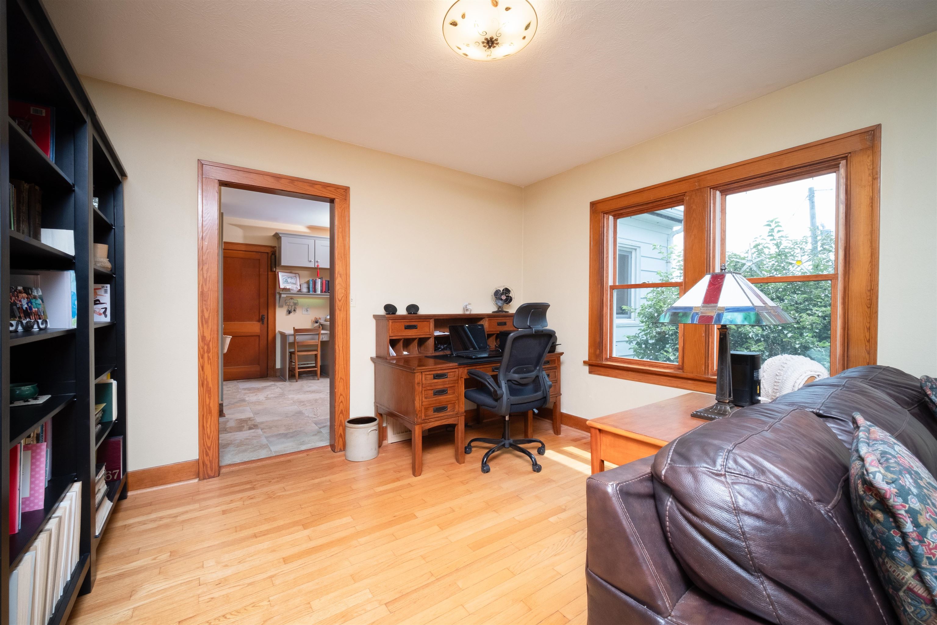 9783 North Main Road Rockton, IL 61072 - Photo 15 of 31 a living room with furniture a bookshelf and a large window