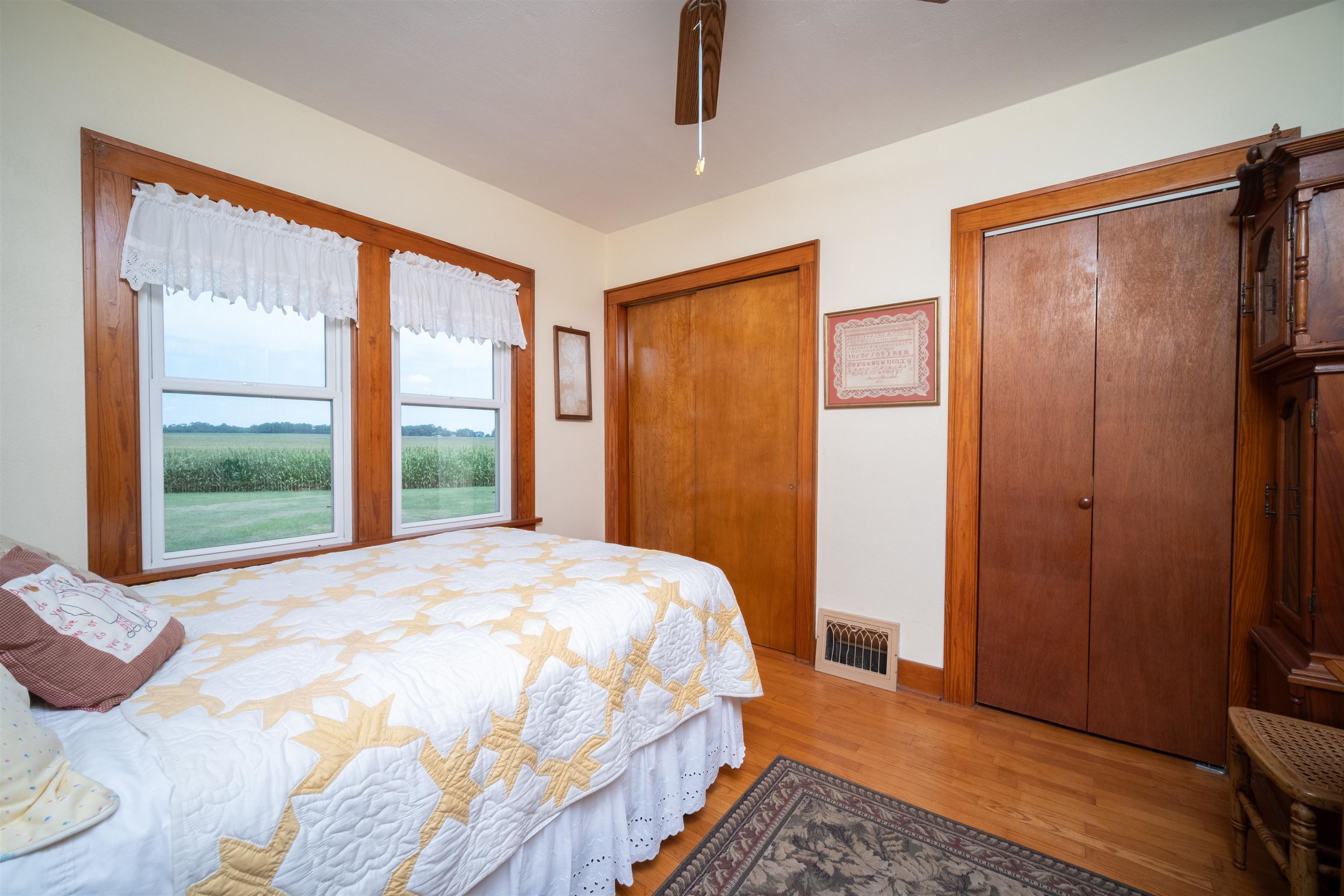 9783 North Main Road Rockton, IL 61072 - Photo 21 of 31 a bedroom with a bed closet and a large window
