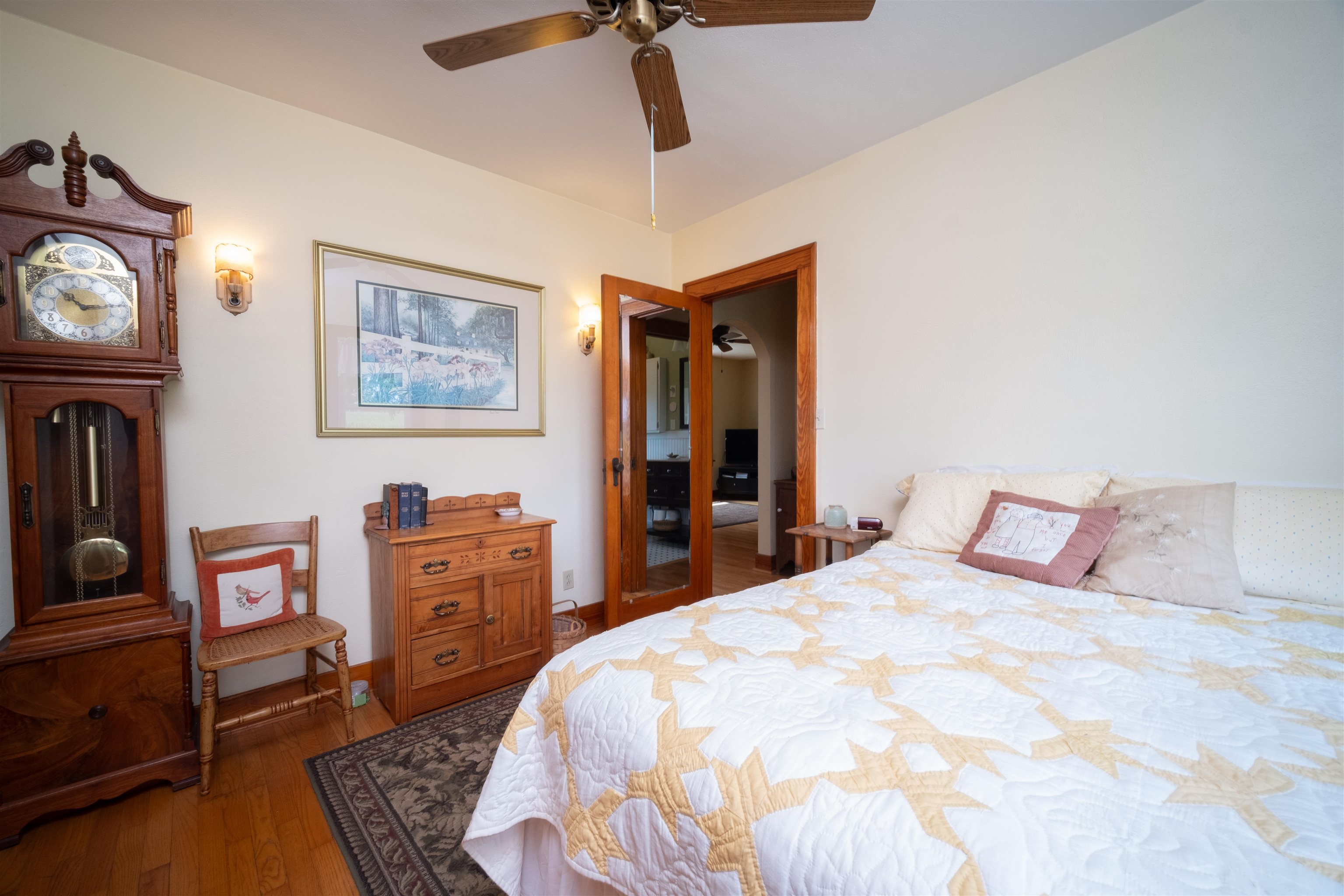 9783 North Main Road Rockton, IL 61072 - Photo 22 of 31 a bedroom with a bed and dresser with chair