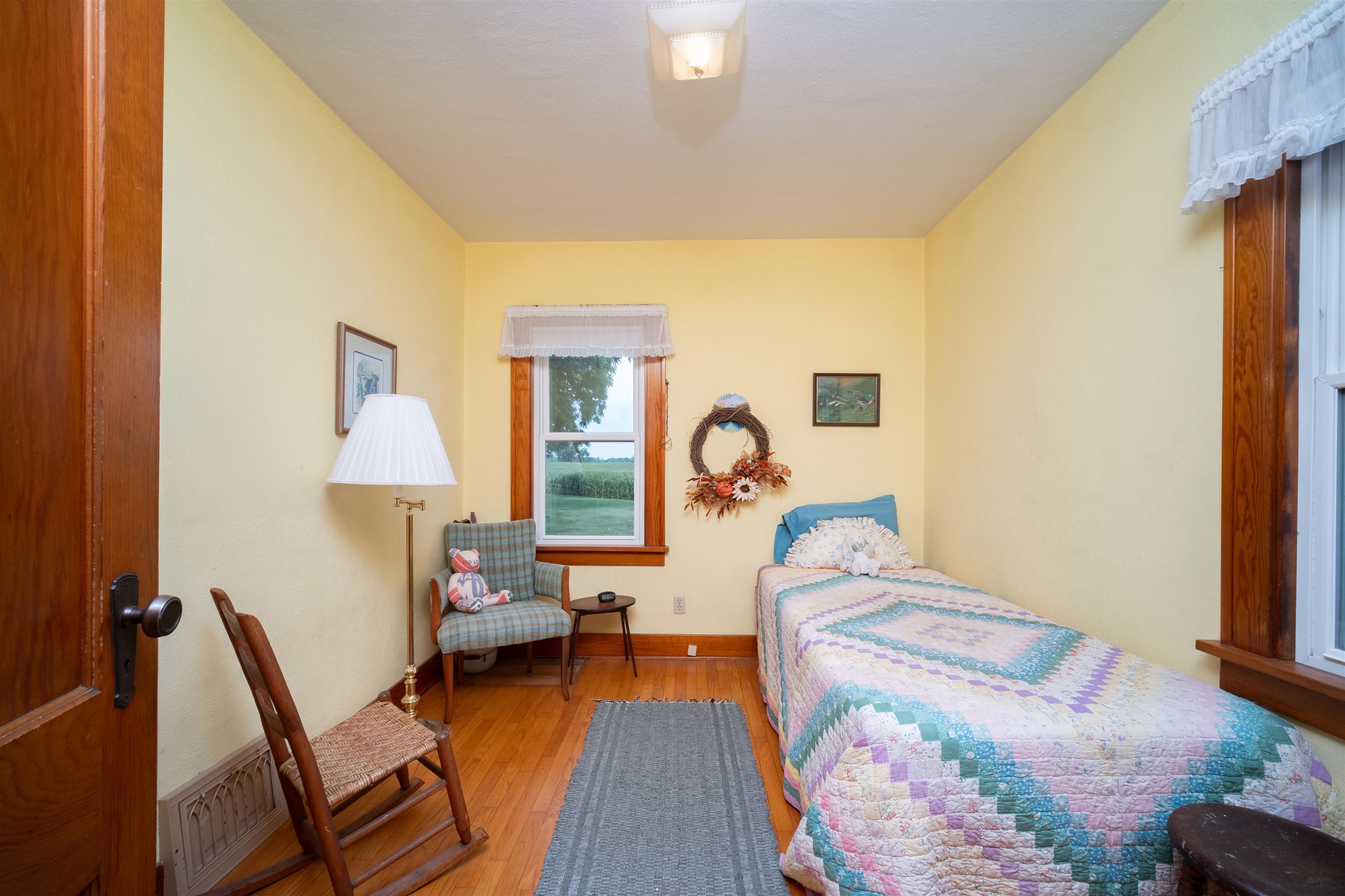 9783 North Main Road Rockton, IL 61072 - Photo 24 of 31 a bedroom with a bed and a chandelier