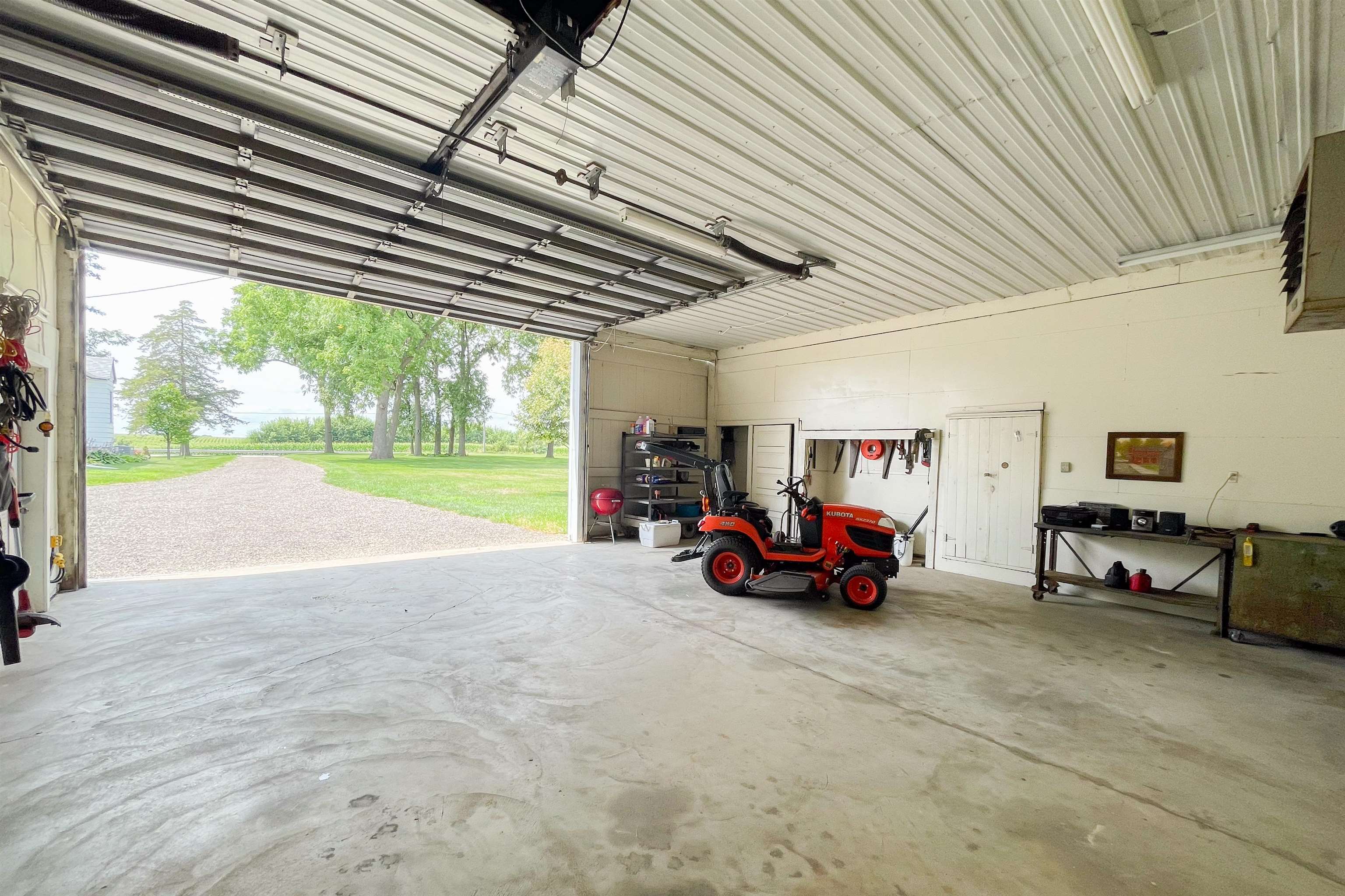 9783 North Main Road Rockton, IL 61072 - Photo 27 of 31 a view of car parked in garage