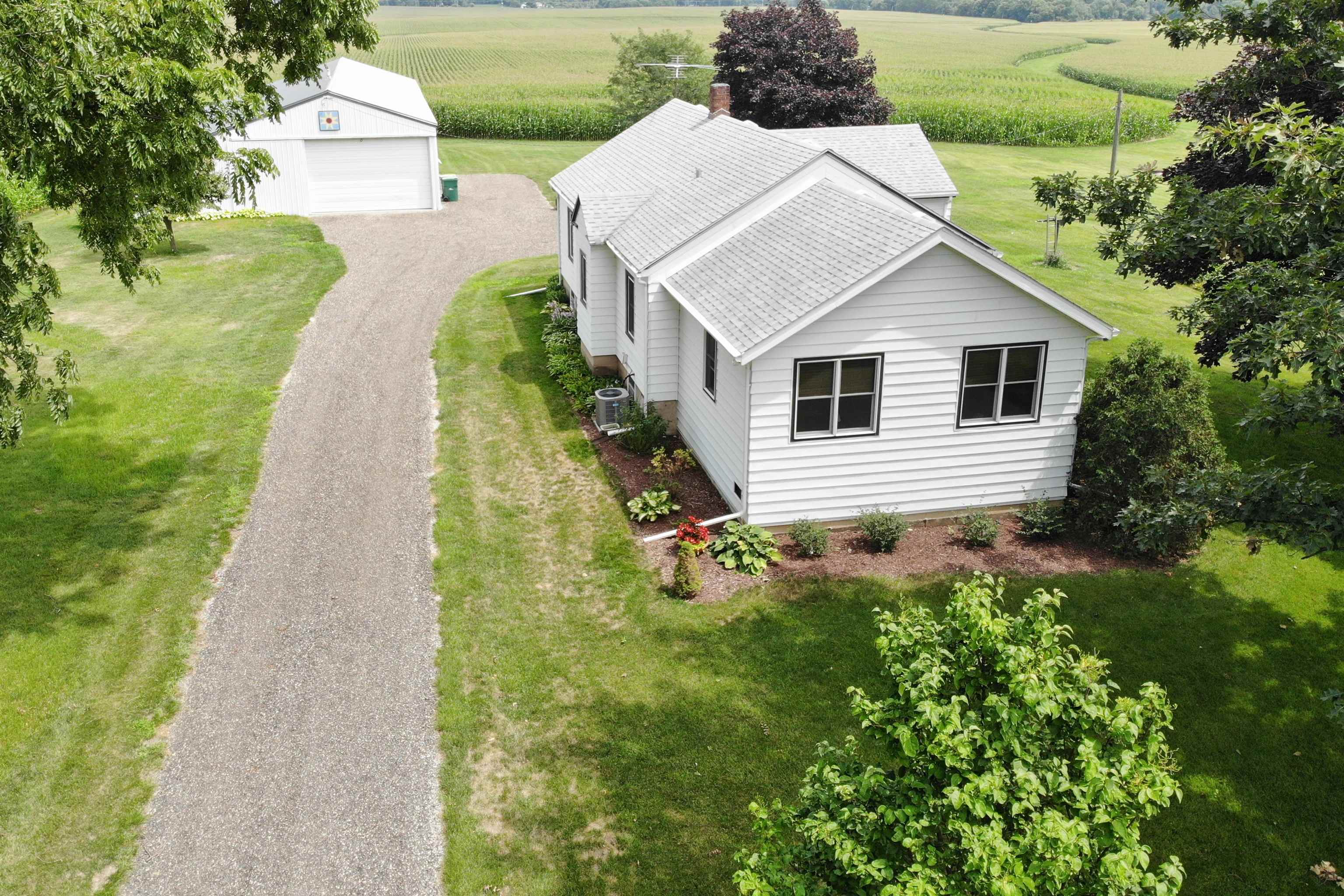 9783 North Main Road Rockton, IL 61072 - Photo 3 of 31 a aerial view of a house with yard and green space