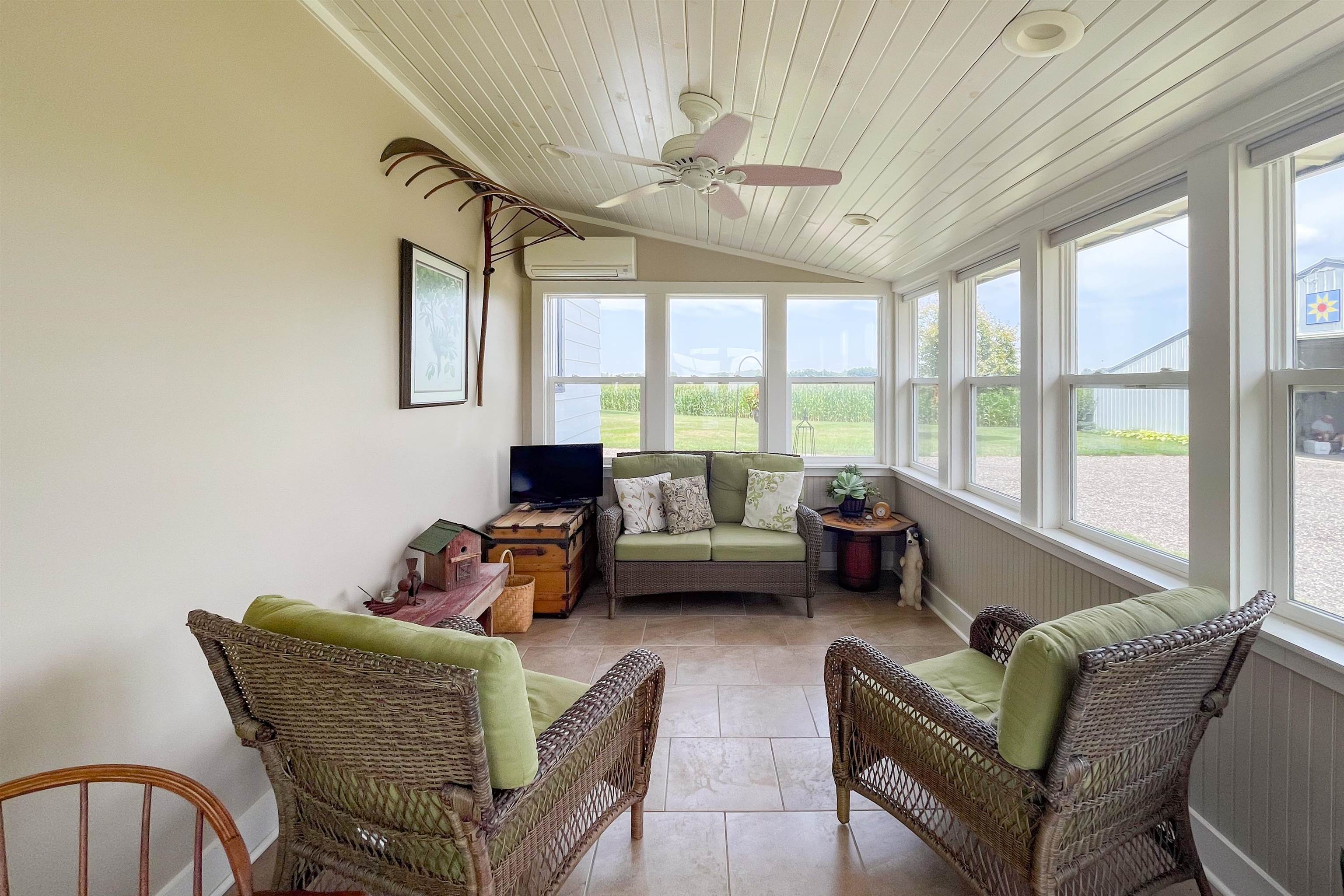 9783 North Main Road Rockton, IL 61072 - Photo 6 of 31 a living room with furniture and a large window
