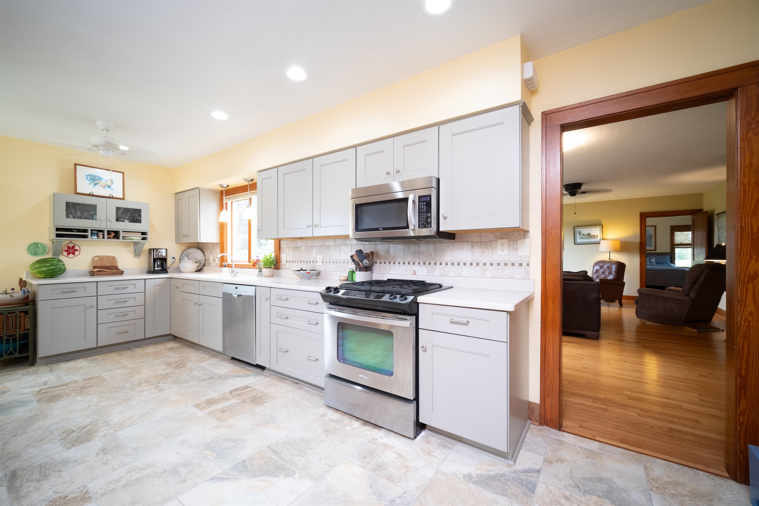 9783 North Main Road Rockton, IL 61072 - Photo 8 of 31 a kitchen with stainless steel appliances granite countertop a stove sink and cabinets
