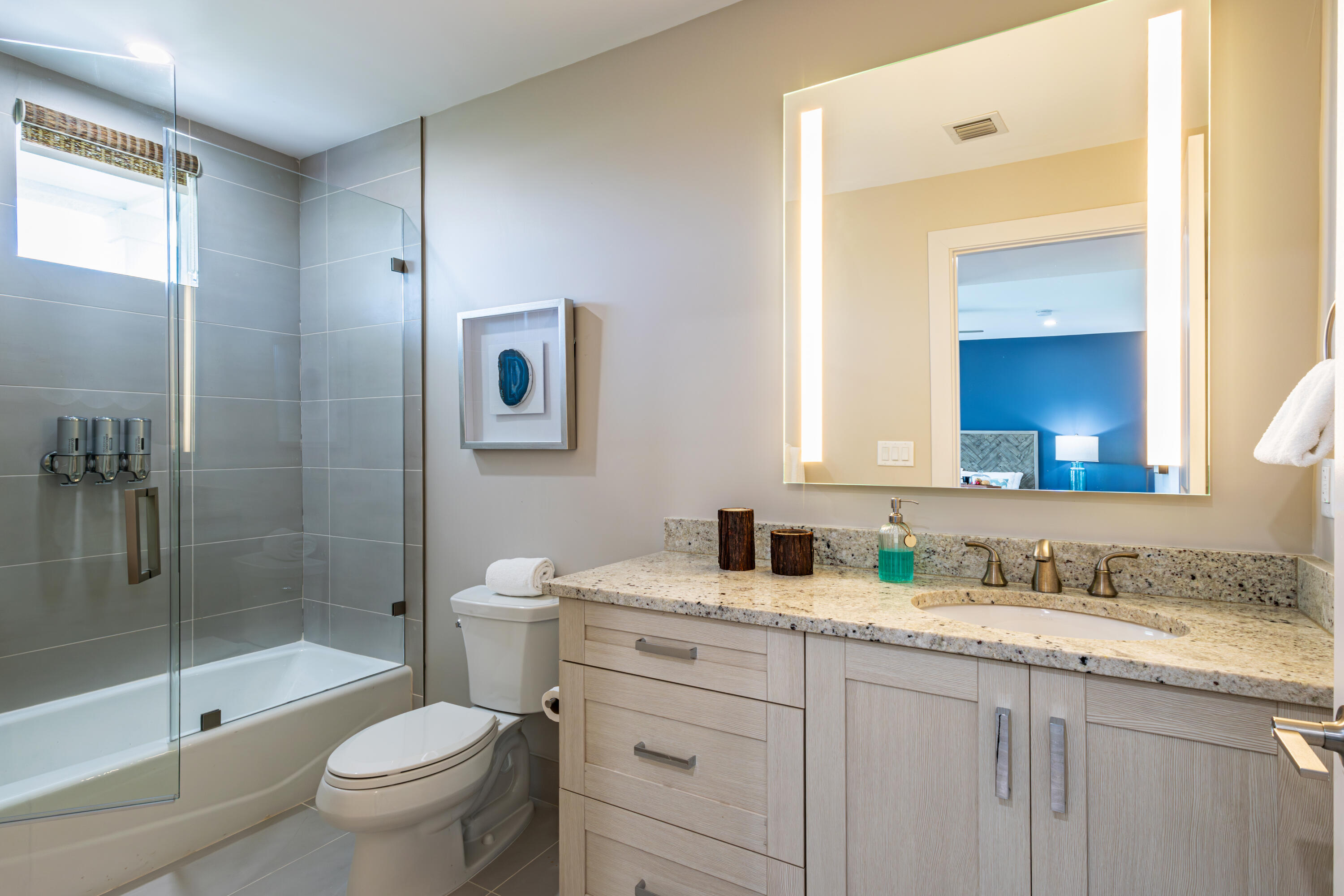 46 East Playa Largo Boulevard Key Largo, FL 33037 - Photo 2 of 48 a bathroom with a granite countertop sink toilet and shower