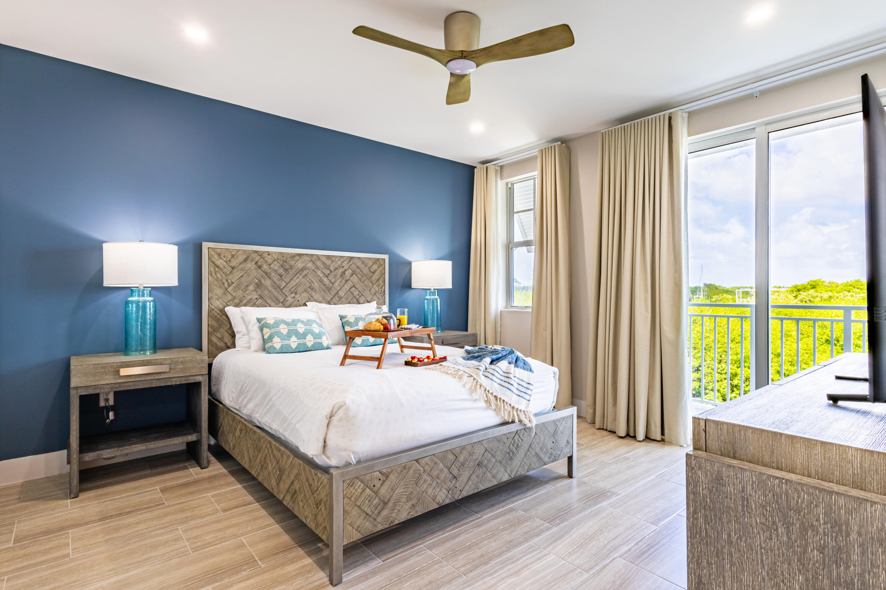 46 East Playa Largo Boulevard Key Largo, FL 33037 - Photo 39 of 48 a bedroom with a large bed and a large window