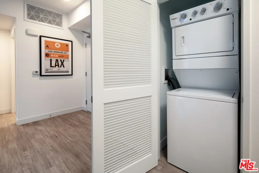 10568 Promenade Gateway, Unit 451 El Monte, CA 91731 - Photo 11 of 32 a view of a storage & utility room with washer and dryer