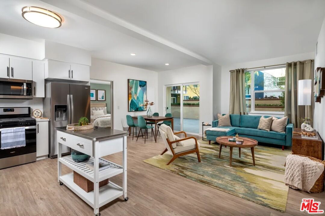 10568 Promenade Gateway, Unit 451 El Monte, CA 91731 - Photo 6 of 32 a living room with furniture and a fireplace