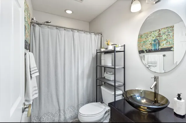 a bathroom with a toilet and a sink