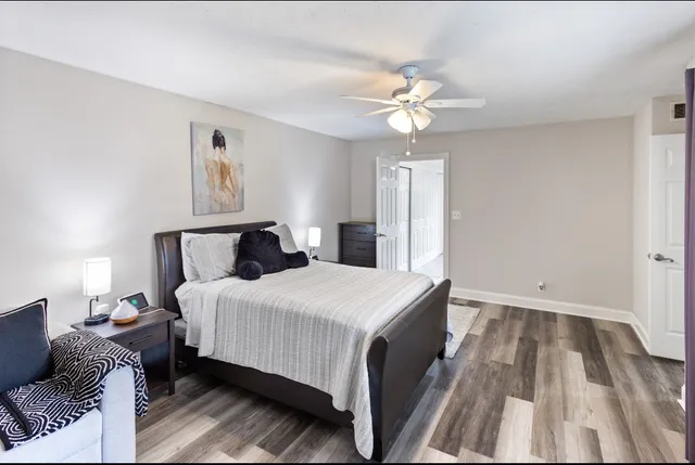 a bedroom with bed and window