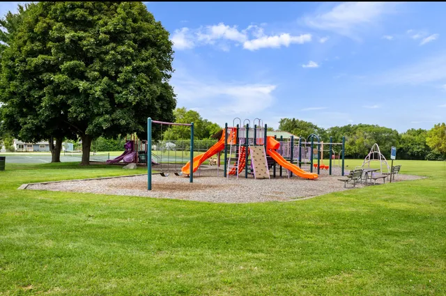 a view of park with swings