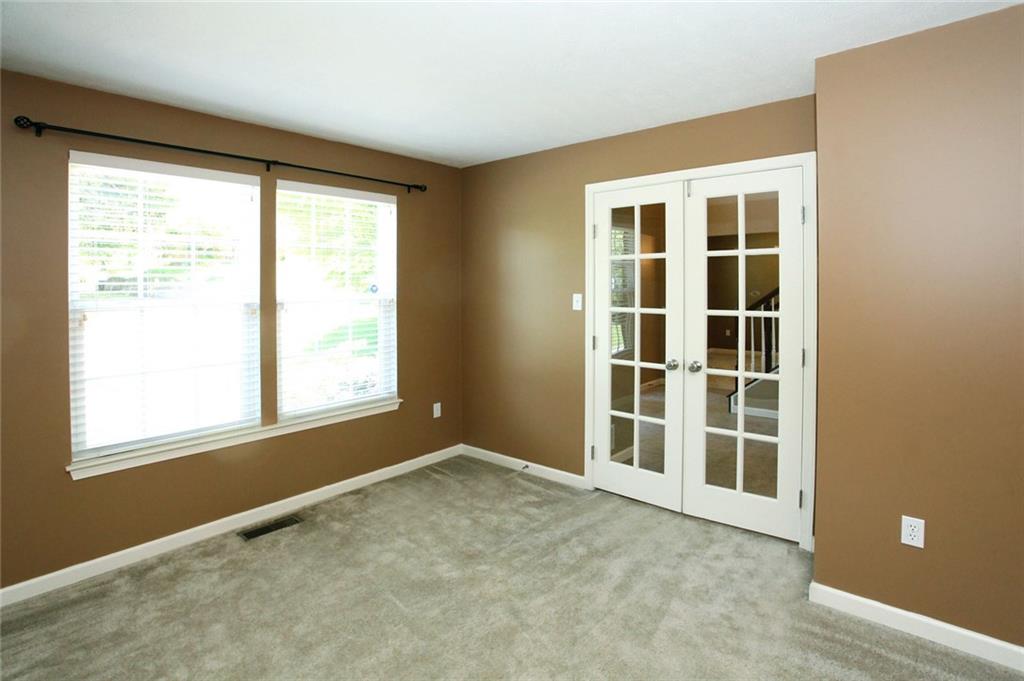 9780 Grosick Road Pittsburgh, PA 15237 - Photo 3 of 22 Den with plenty of lighting. Close the French doors for some privacy.