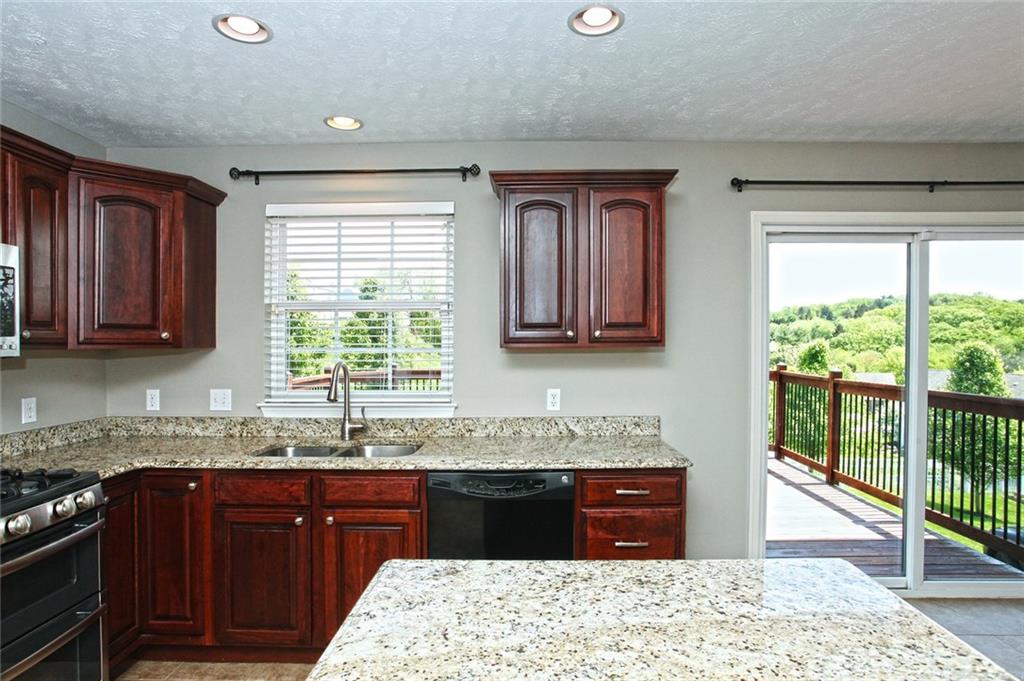 9780 Grosick Road Pittsburgh, PA 15237 - Photo 6 of 22 Bright and Light Kitchen for making plenty of meals and entertaining. Walk-out onto the large tranquil deck and see stunning views for many relaxing days.