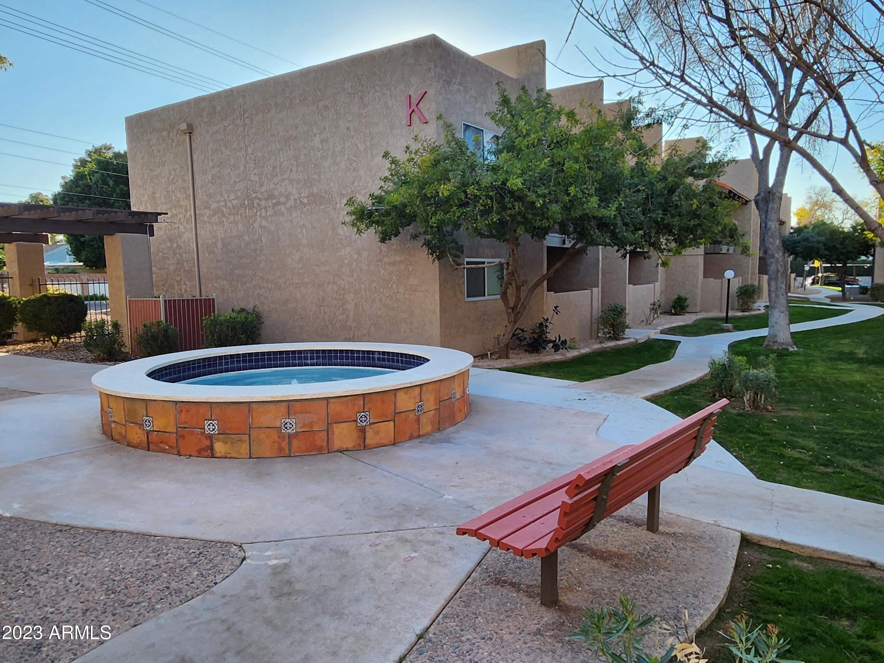 5525 East Thomas Road, Unit K1 Phoenix, AZ 85018 - Photo 2 of 46 K Building with fountain and bench