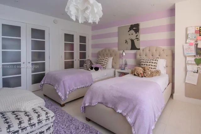 a bedroom with bed and a window