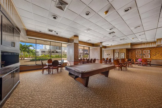 a outdoor space with lots of chairs and chandelier