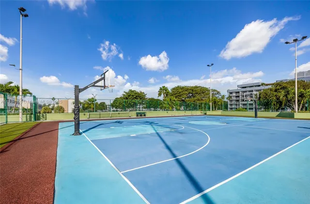 a patio with swimming pool table and chairs