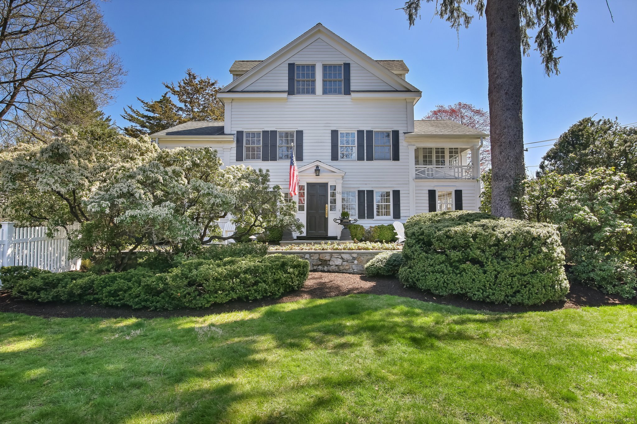 621 Weed Street New Canaan, CT 06840 - Photo 1 of 35 a front view of a house with a garden