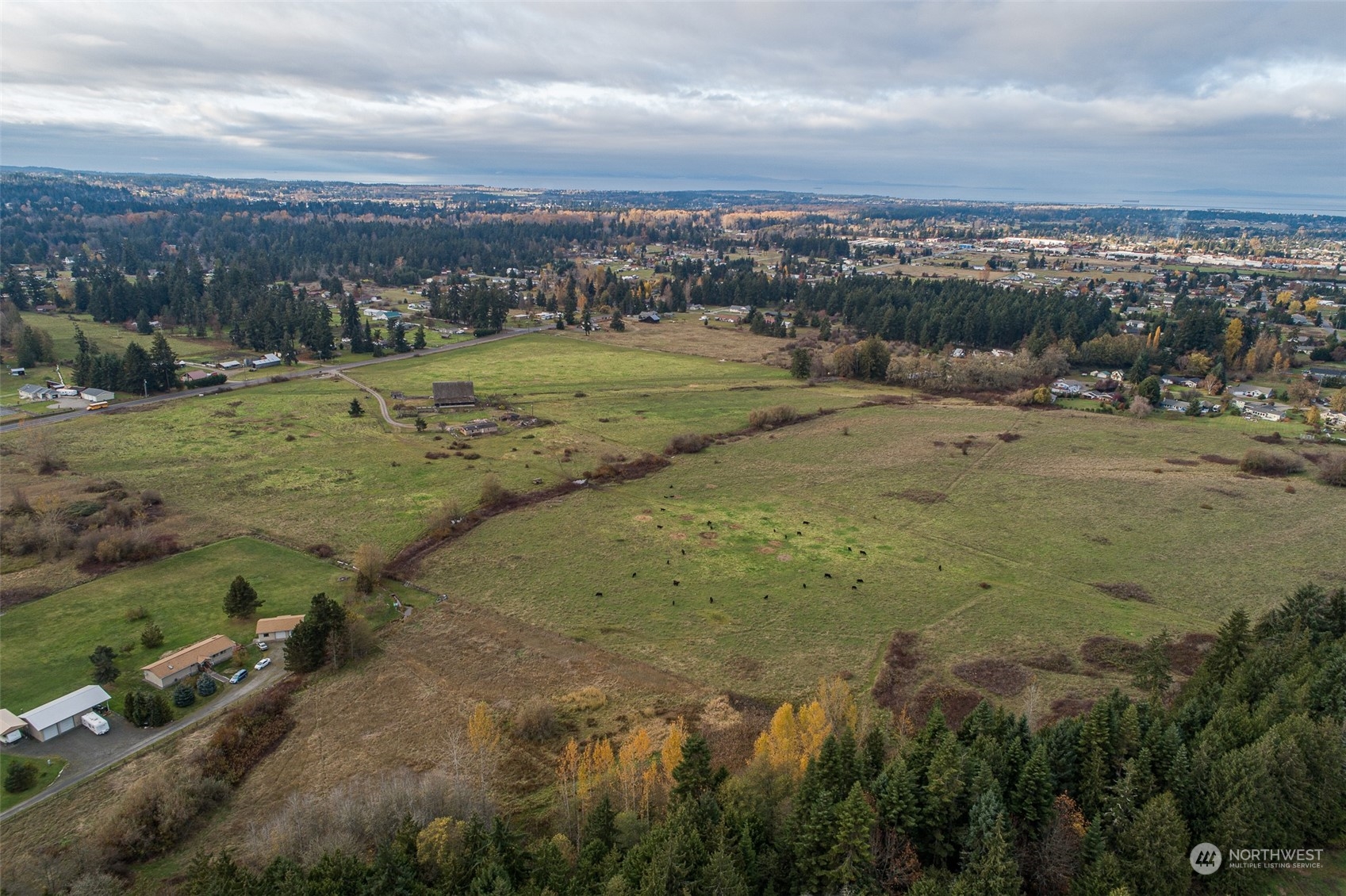 1239 River Road Sequim, WA 98382 - Photo 2 of 7 a view of a field with an ocean