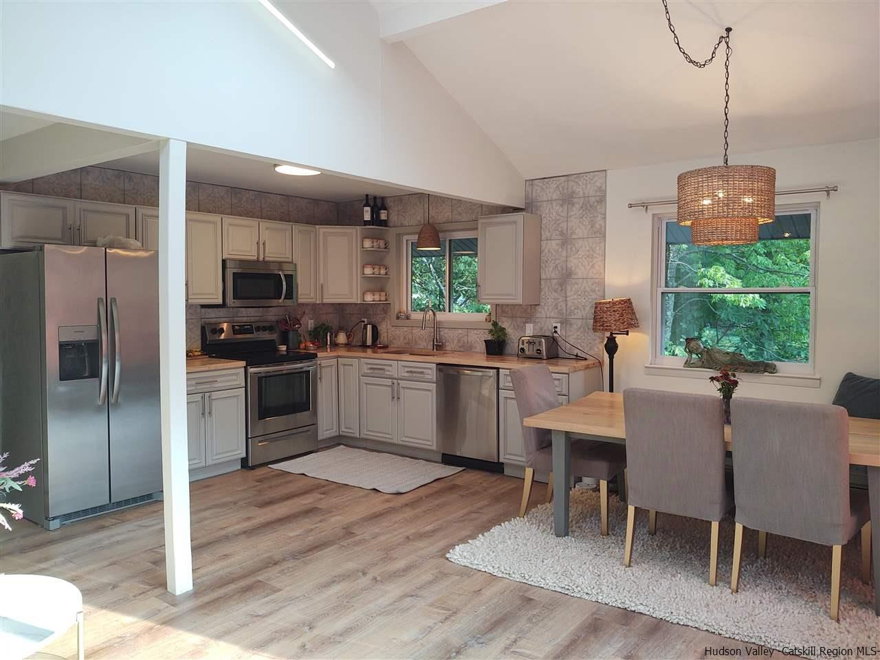 2 Mountain Valley Road Boiceville, NY 12412 - Photo 11 of 35 a kitchen with white cabinets and stainless steel appliances