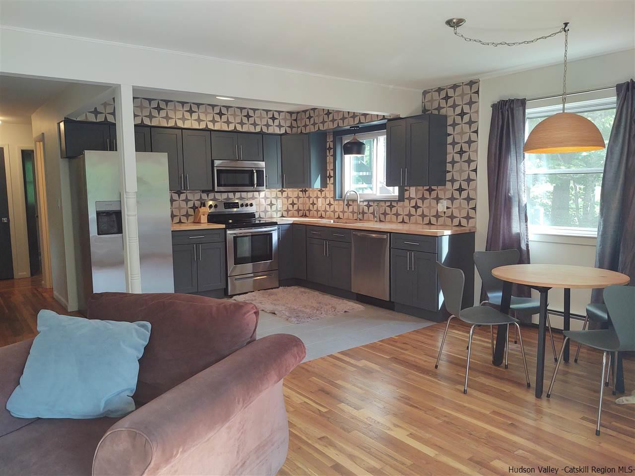 2 Mountain Valley Road Boiceville, NY 12412 - Photo 25 of 35 a kitchen with stainless steel appliances granite countertop a stove top oven a refrigerator and a dining table