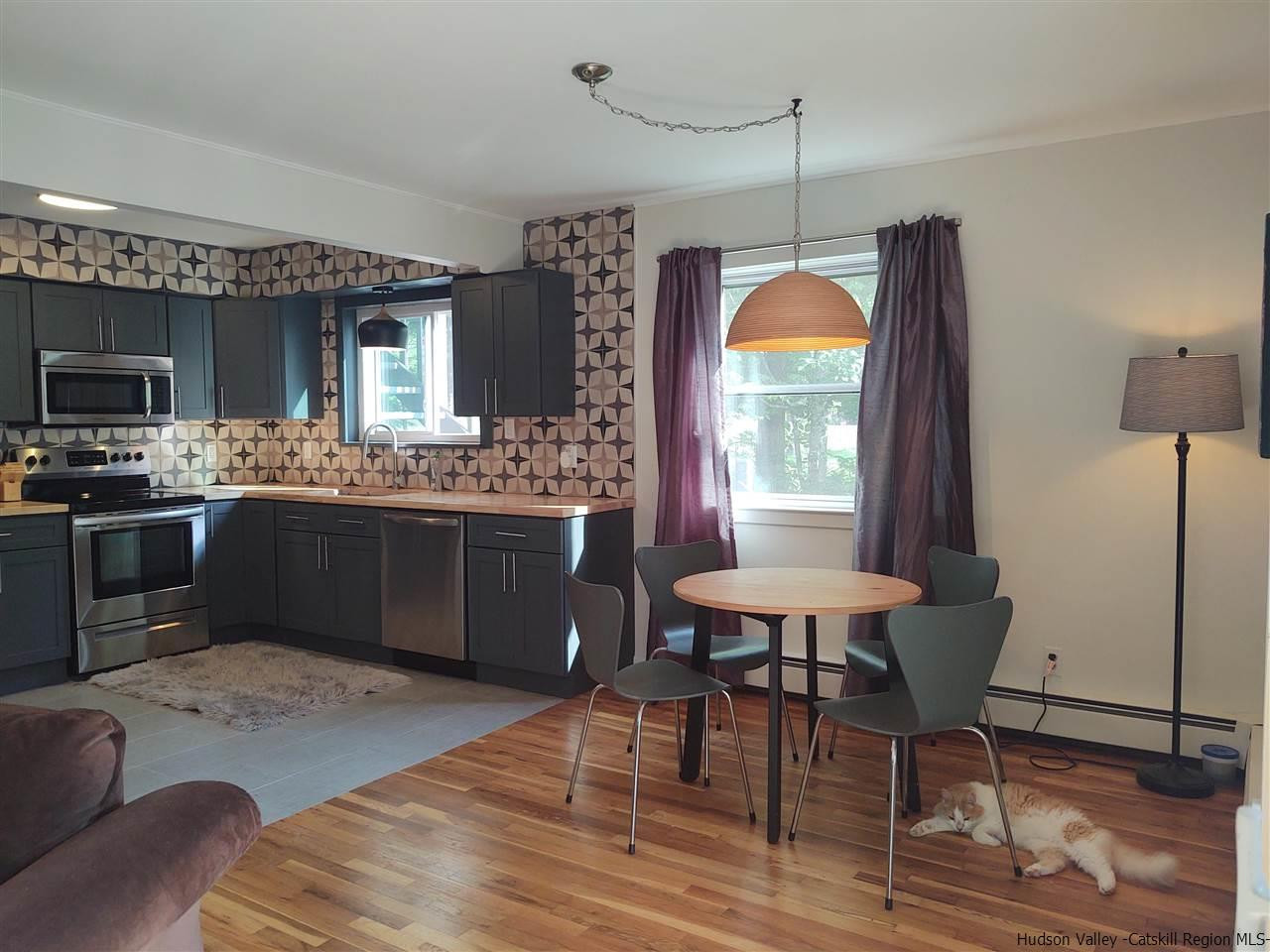 2 Mountain Valley Road Boiceville, NY 12412 - Photo 29 of 35 a kitchen with a table chairs sink and microwave