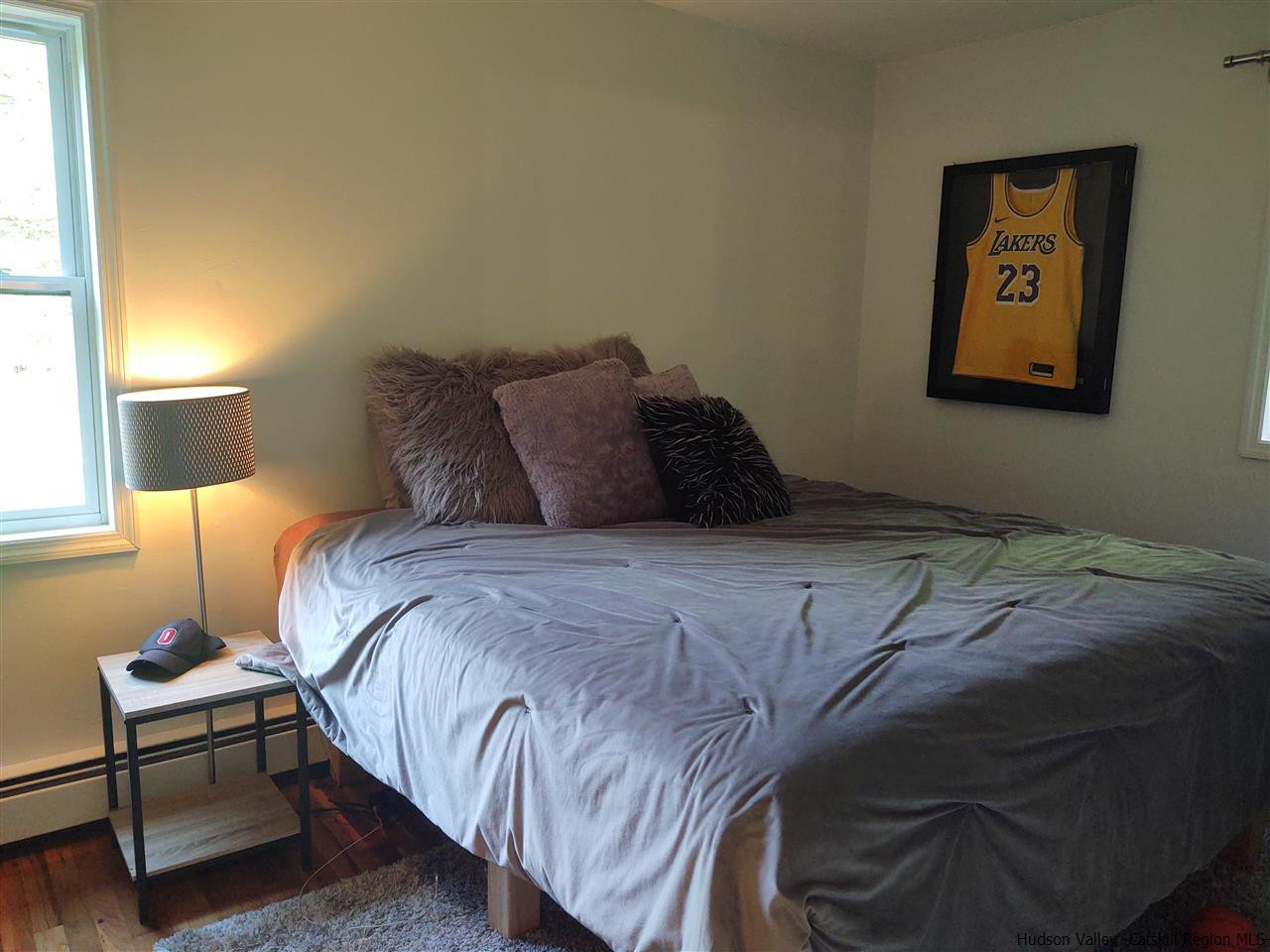 2 Mountain Valley Road Boiceville, NY 12412 - Photo 32 of 35 a bedroom with a bed and a lamp on dresser