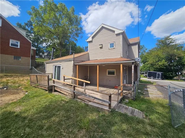 a view of yard with swimming pool and green space