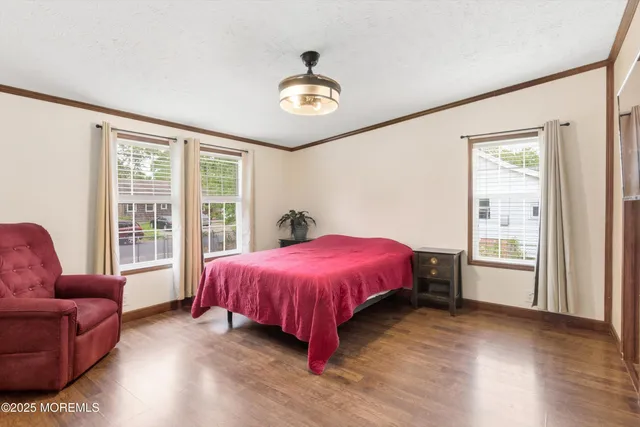 a spacious bedroom with a bed and a couch